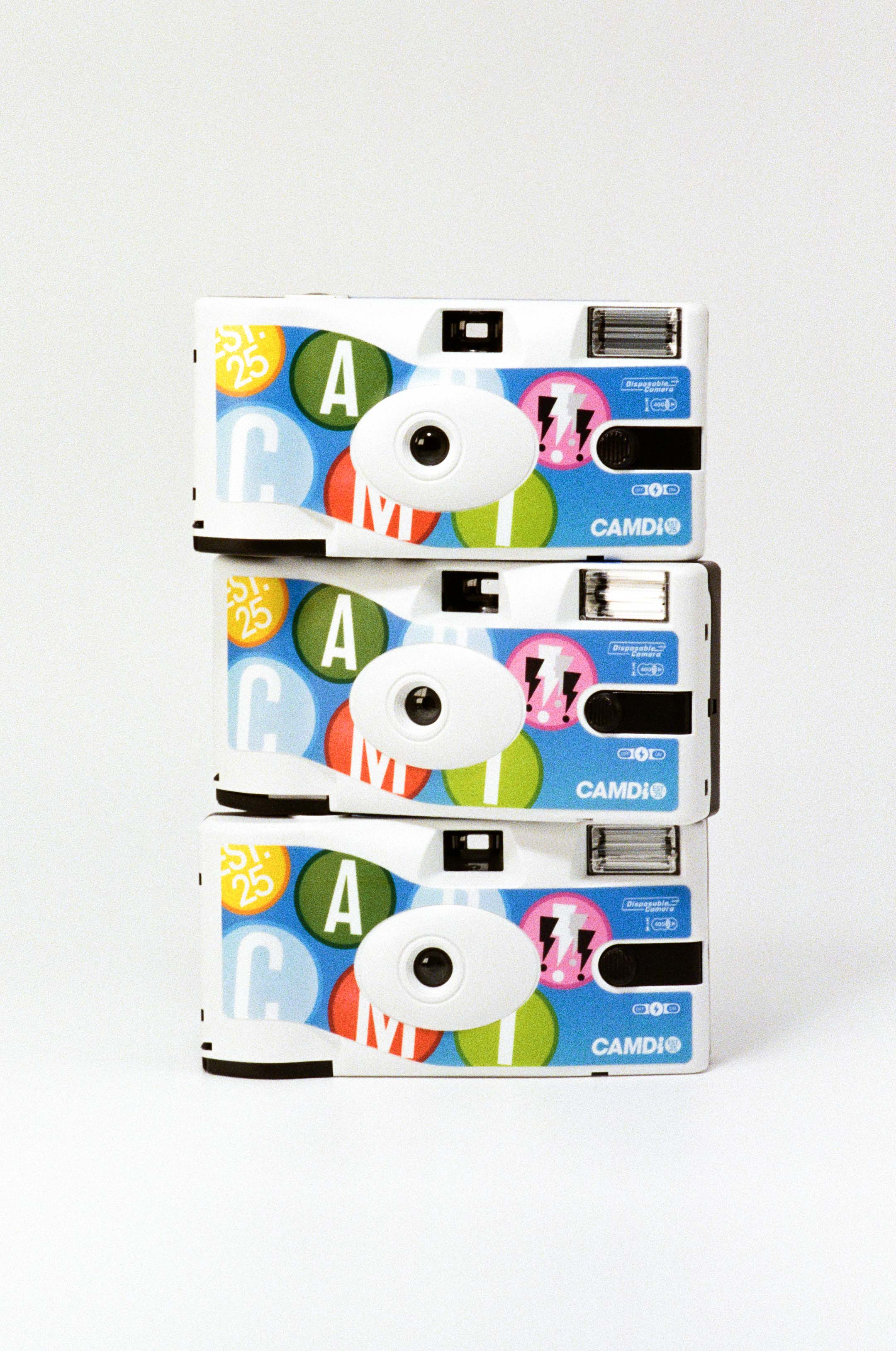 Three colorful camera stacked on a white background