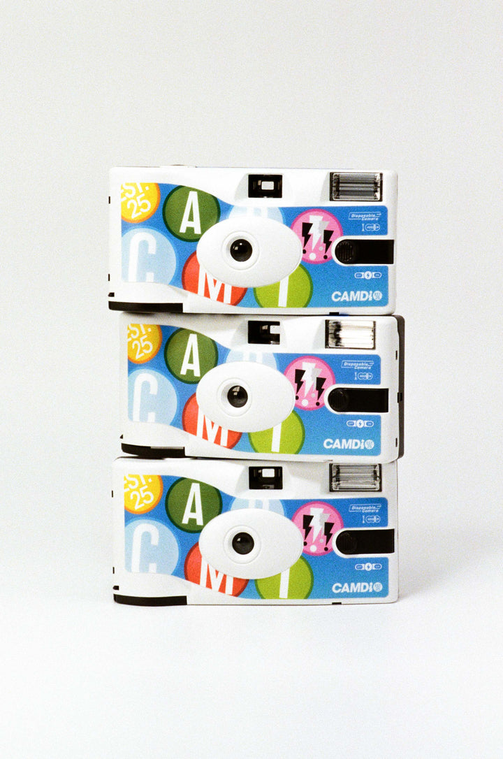 Three colorful camera stacked on a white background