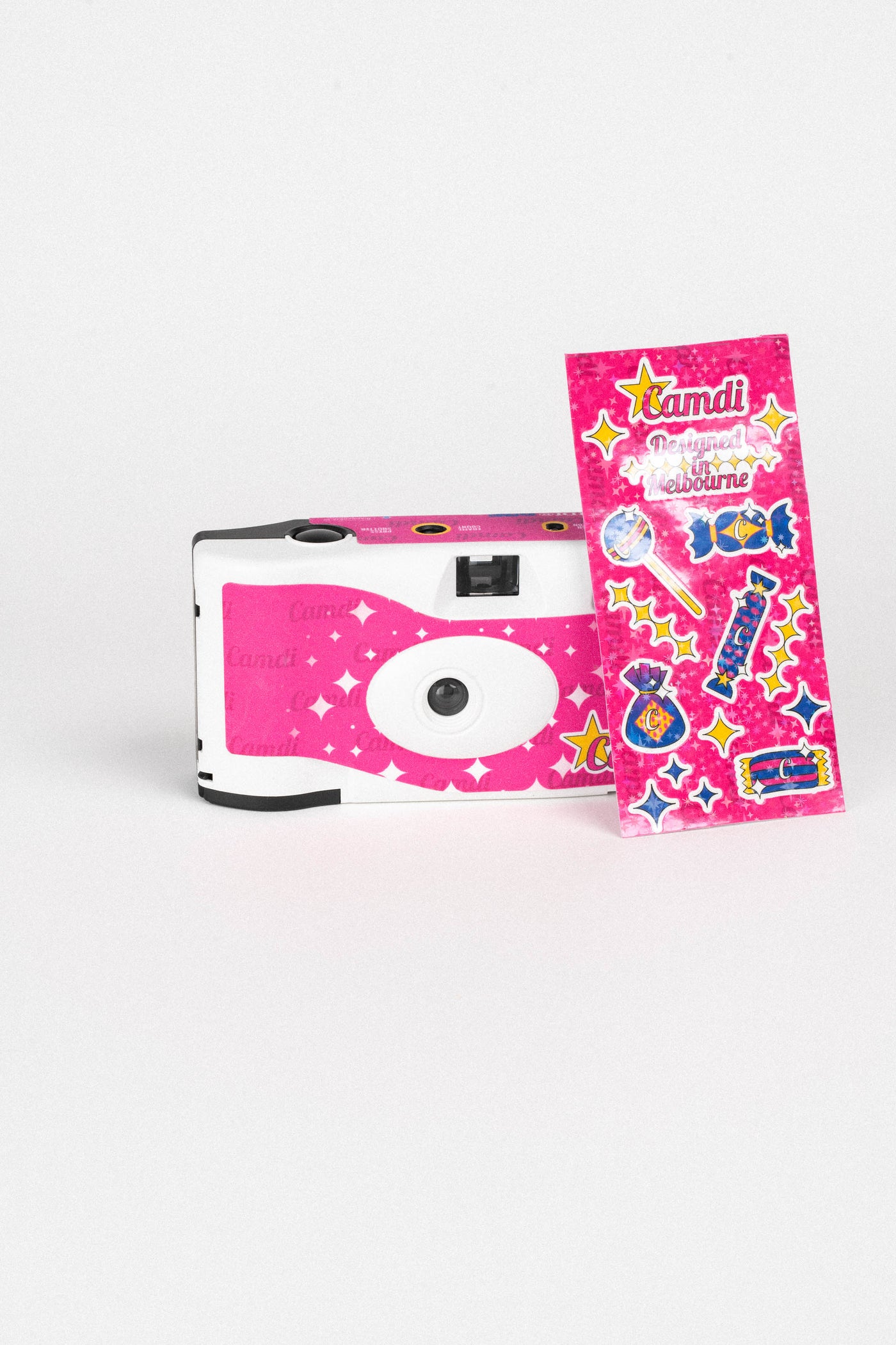 CAMDI pink disposable camera product shot, angled view